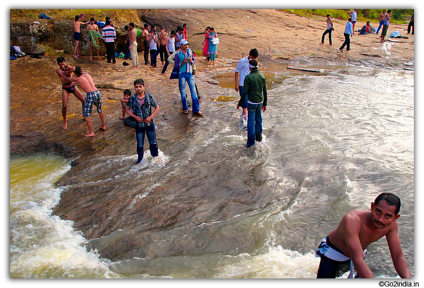 Taking bath in flowing water stream at Chaparai