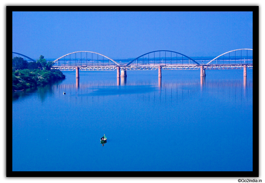 Boat below the bridge