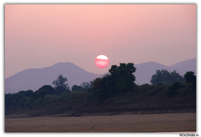 Red sun before sunset on river Godavari