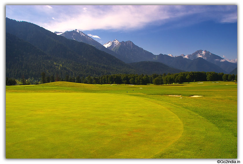 Green and hills in golf ground of Pahalgam