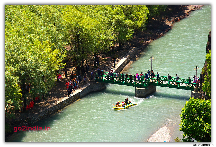 Bride crossing the river at Betaab valley