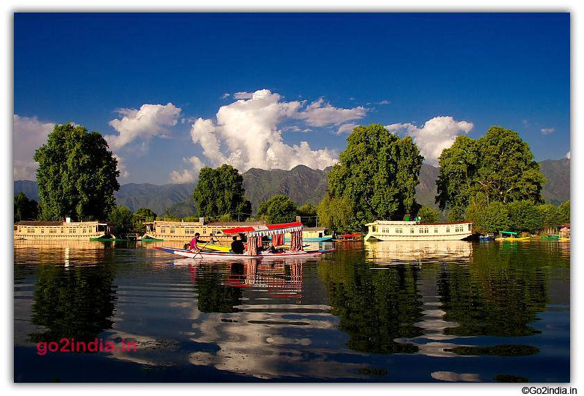 Housebat and hills by the side of Dal Lake