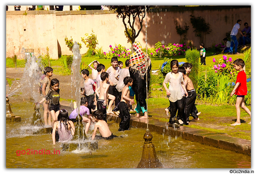 Kids enjoying in water at Nishat Bagh
