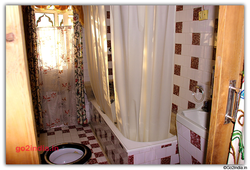 Attached toilet and bath tub inside Houseboats
