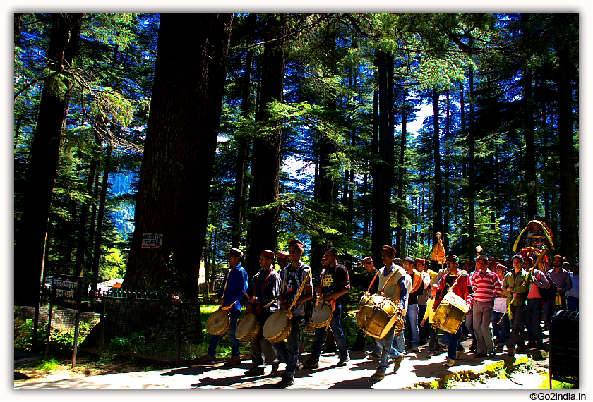 Procession carrying idols going towards goddess Hidamba temple near Manali 