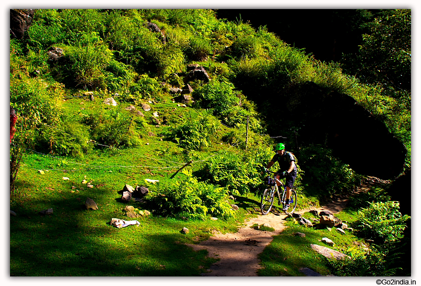 A cyclist travelling to Jogini waterfall near Manali 