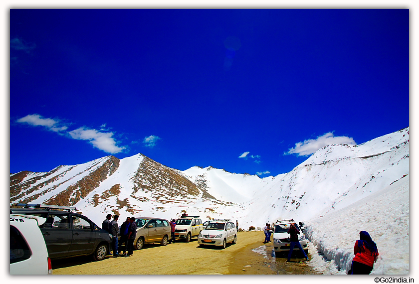 Tourist enjoying snow at Khardungla Pass in Ladakh