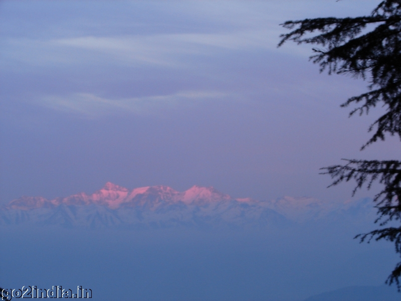 Color of the snow capped hills on sunset at Khajjiar